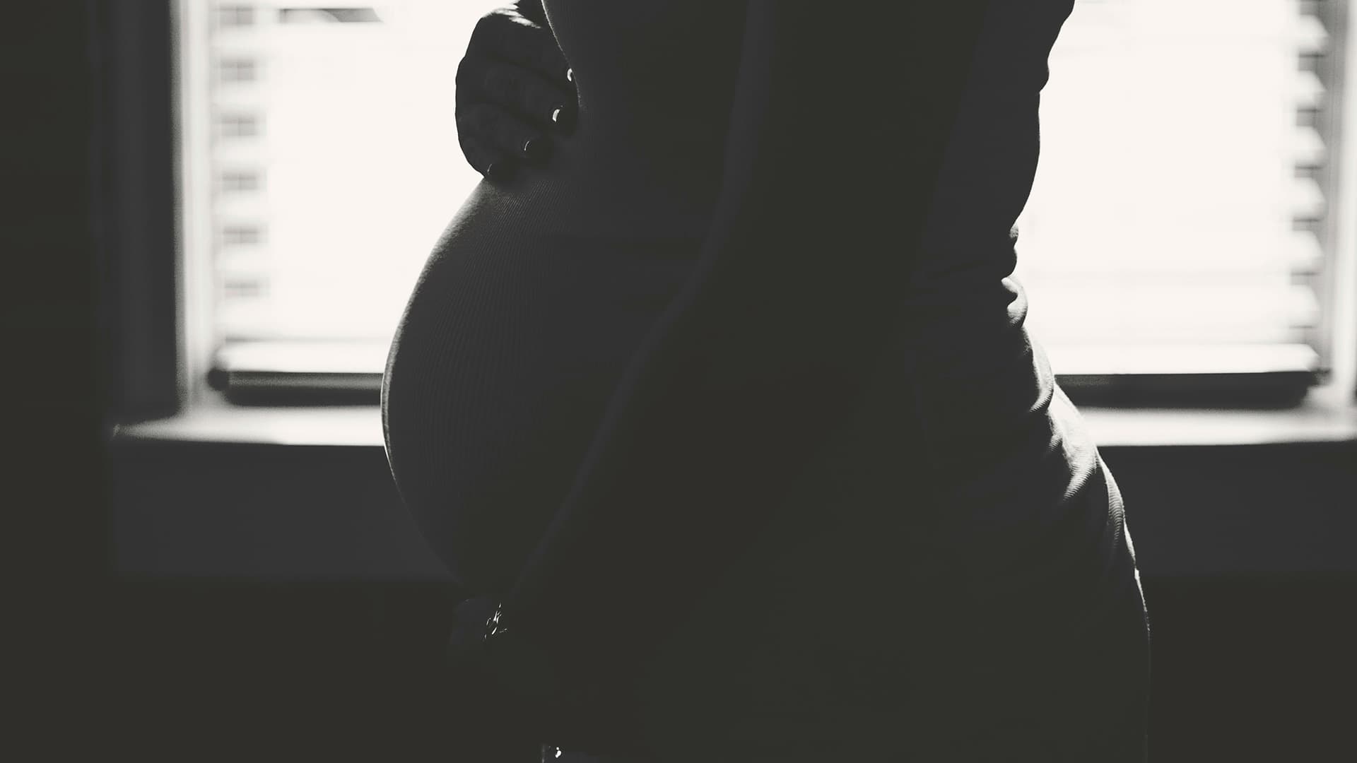 a photo of a pregnant woman who gave up her baby for adoption